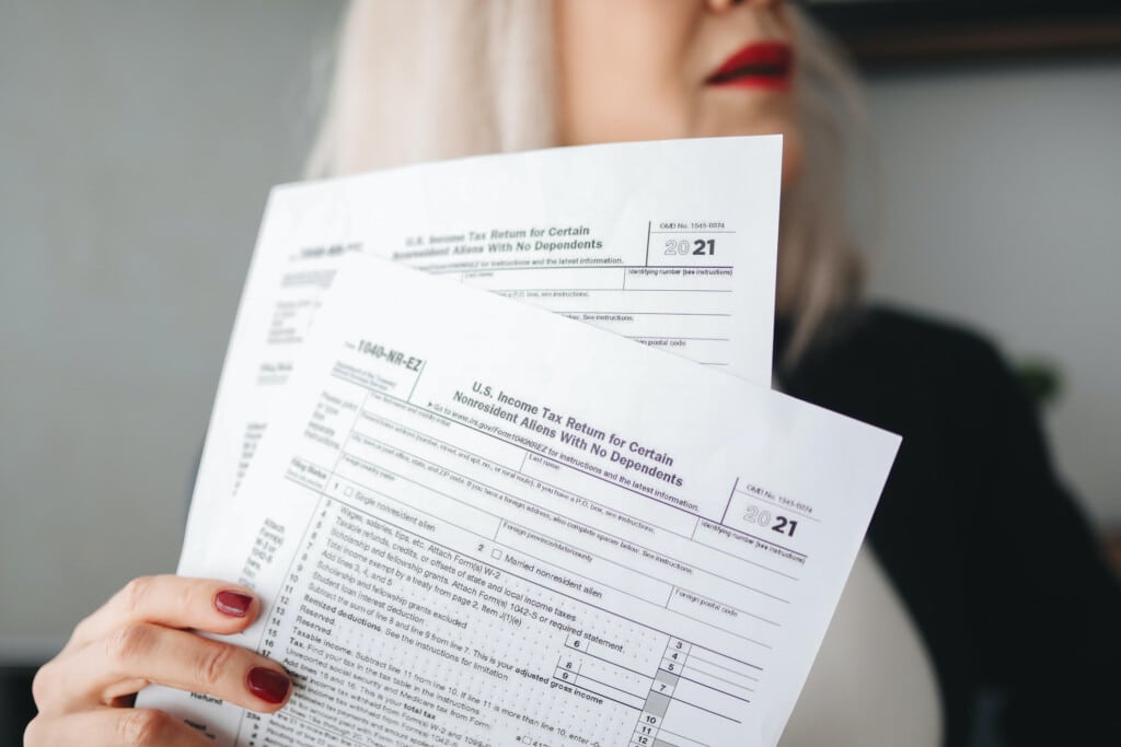 woman holding tax papaers